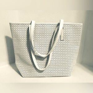 Ultra Chi bag is white perforated with pink lining inside.